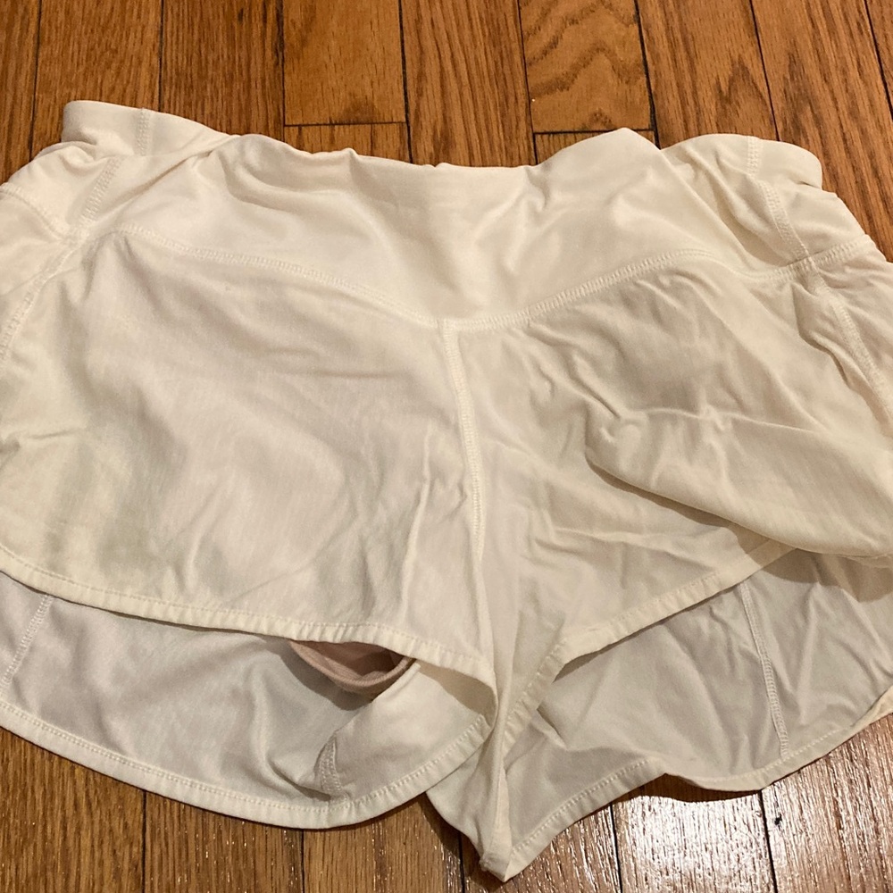 Lululemon white mid rise running shorts size 8